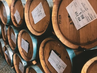 A collection of refurbished wine barrels ready for sale.