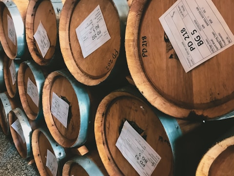 A collection of refurbished wine barrels ready for sale.