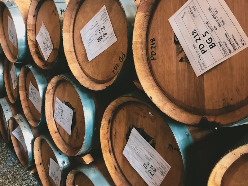 Oak whisky barrels maturing in a Scottish warehouse
