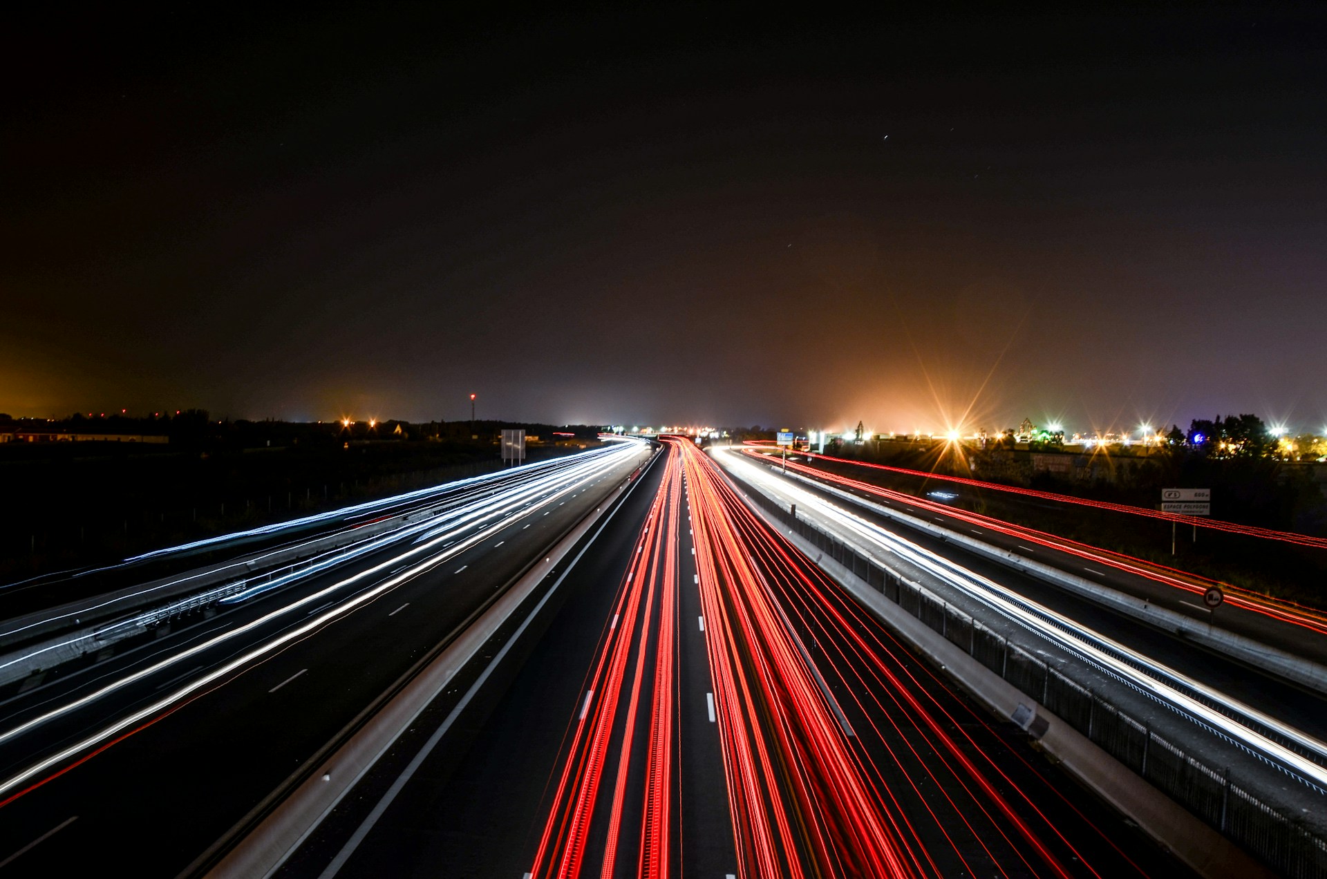 time lapse photography of cars on road during night time