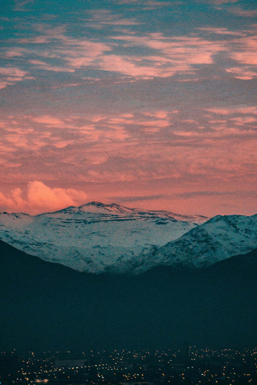 snow covered mountain under cloudy sky during daytime