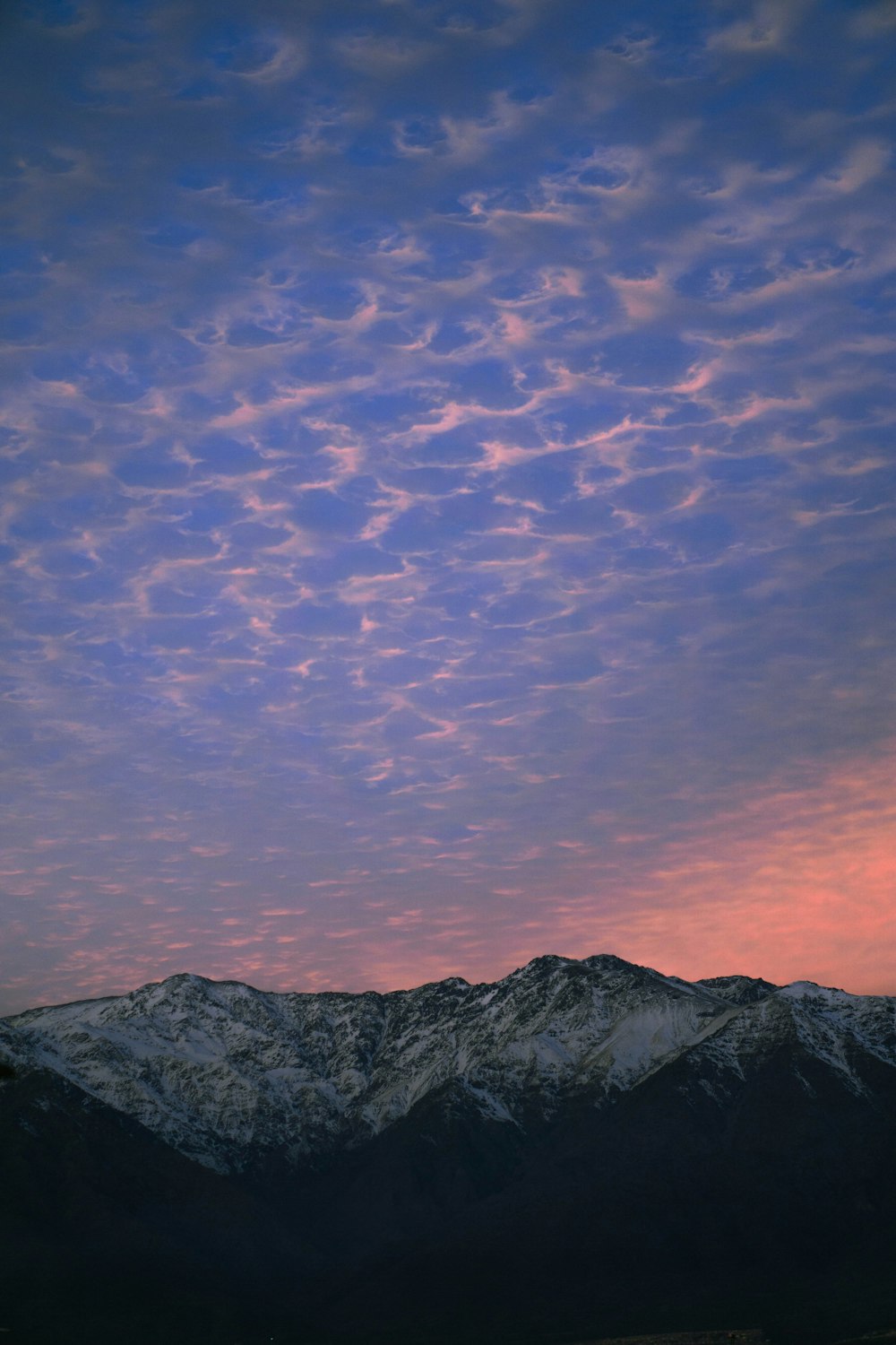 black and white mountains under blue sky