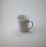 A white ceramic mug featuring a bright, custom sublimation print.