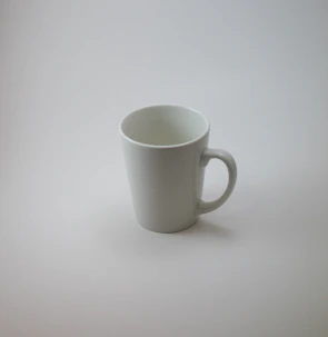 A white ceramic mug featuring a bright, custom sublimation print.