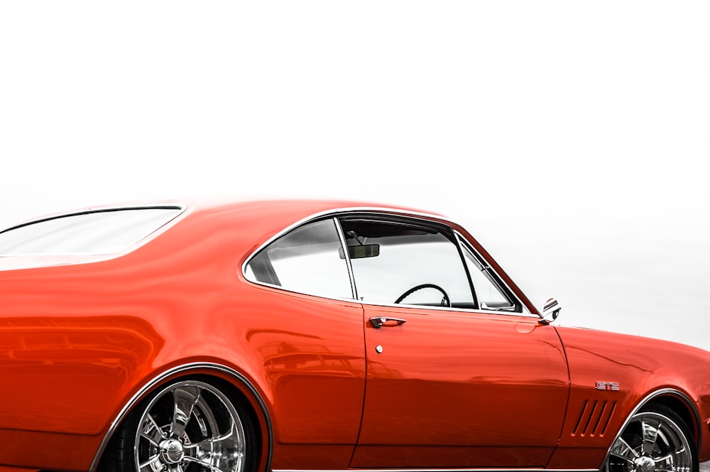 orange porsche 911 on white background