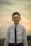 man in white dress shirt wearing black framed eyeglasses