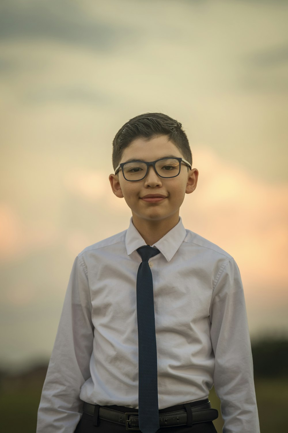 man in white dress shirt wearing black framed eyeglasses