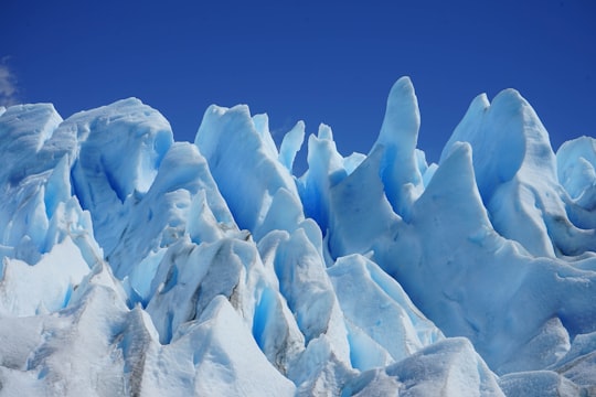 brown rock formation under blue sky during daytime in Perito Moreno Argentina