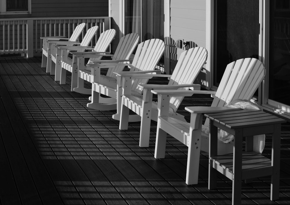grayscale photo of empty chairs