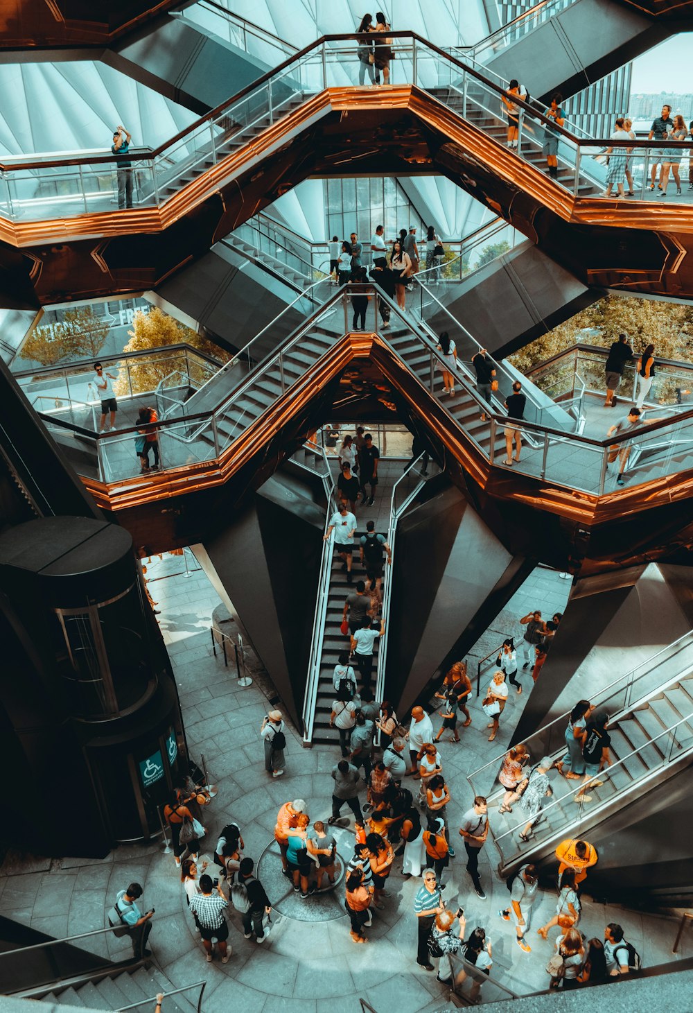 people walking on gray concrete stairs