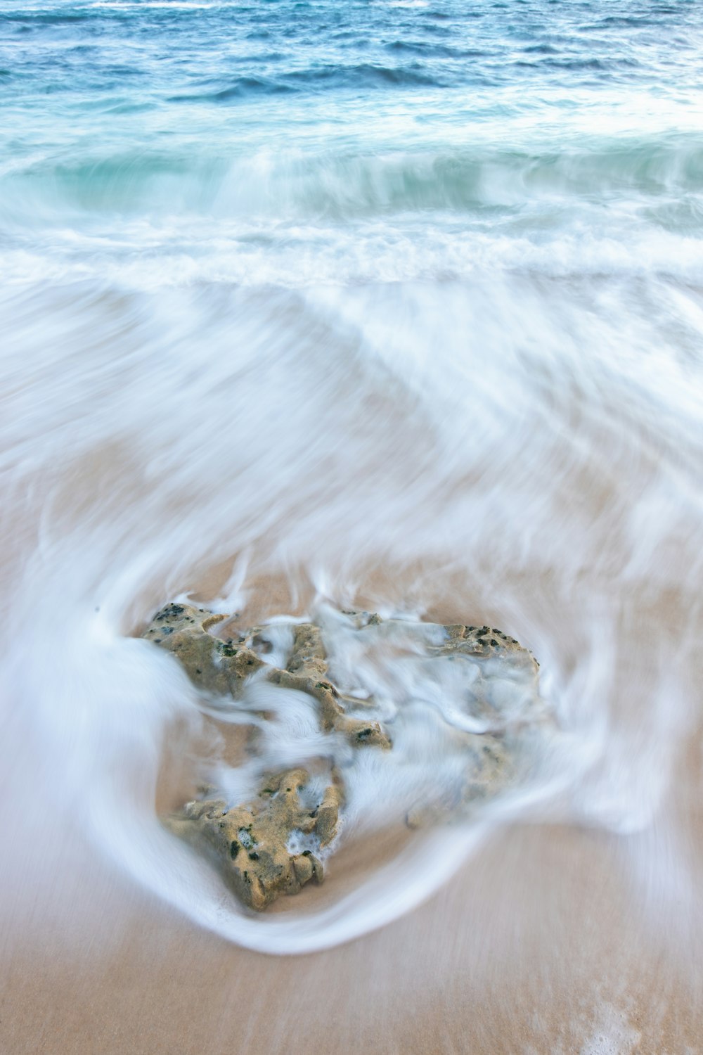 water waves on blue body of water during daytime