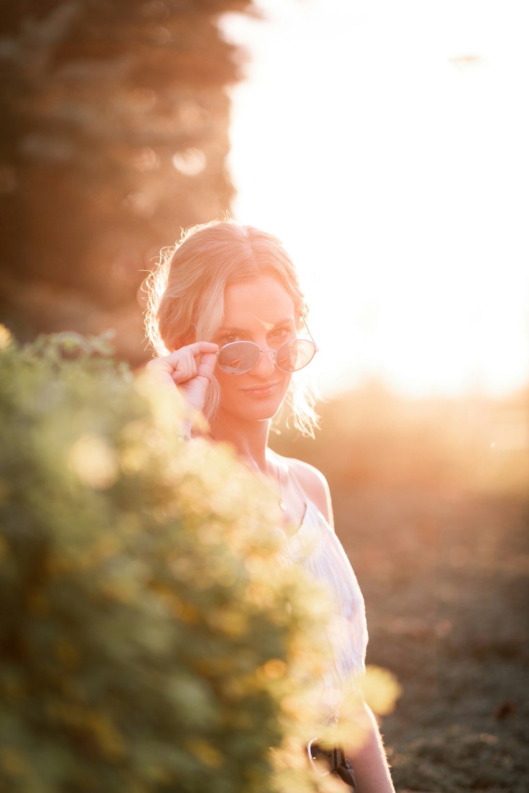 woman in white shirt wearing eyeglasses