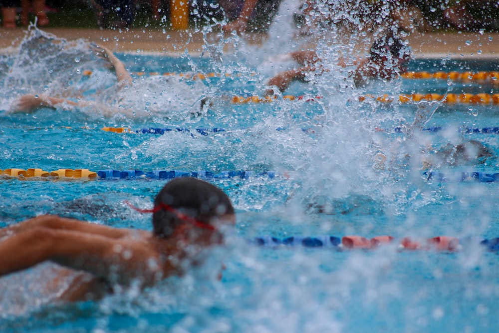 man in swimming pool during daytime