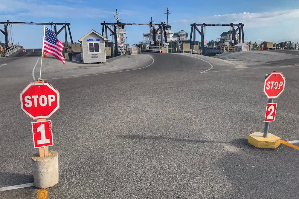 gray concrete road with stop sign