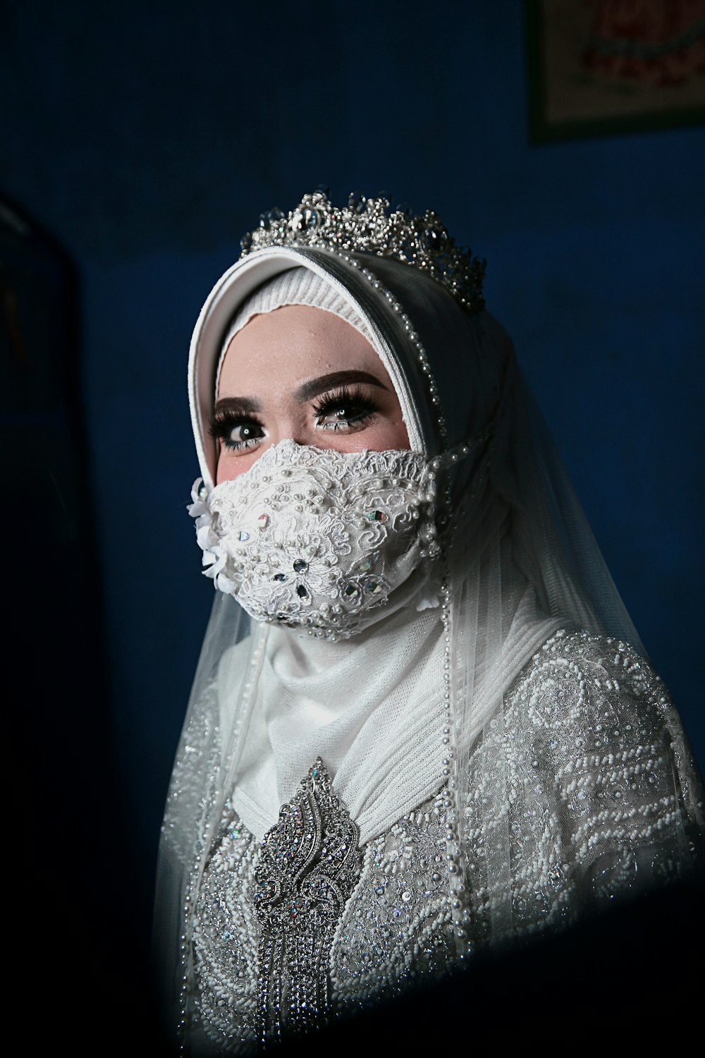 woman in white hijab and white floral hijab