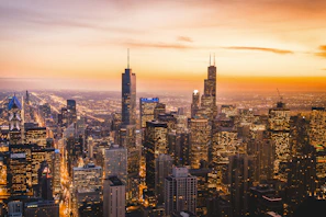 A vibrant cityscape at sunset showcasing iconic landmarks and bustling streets.