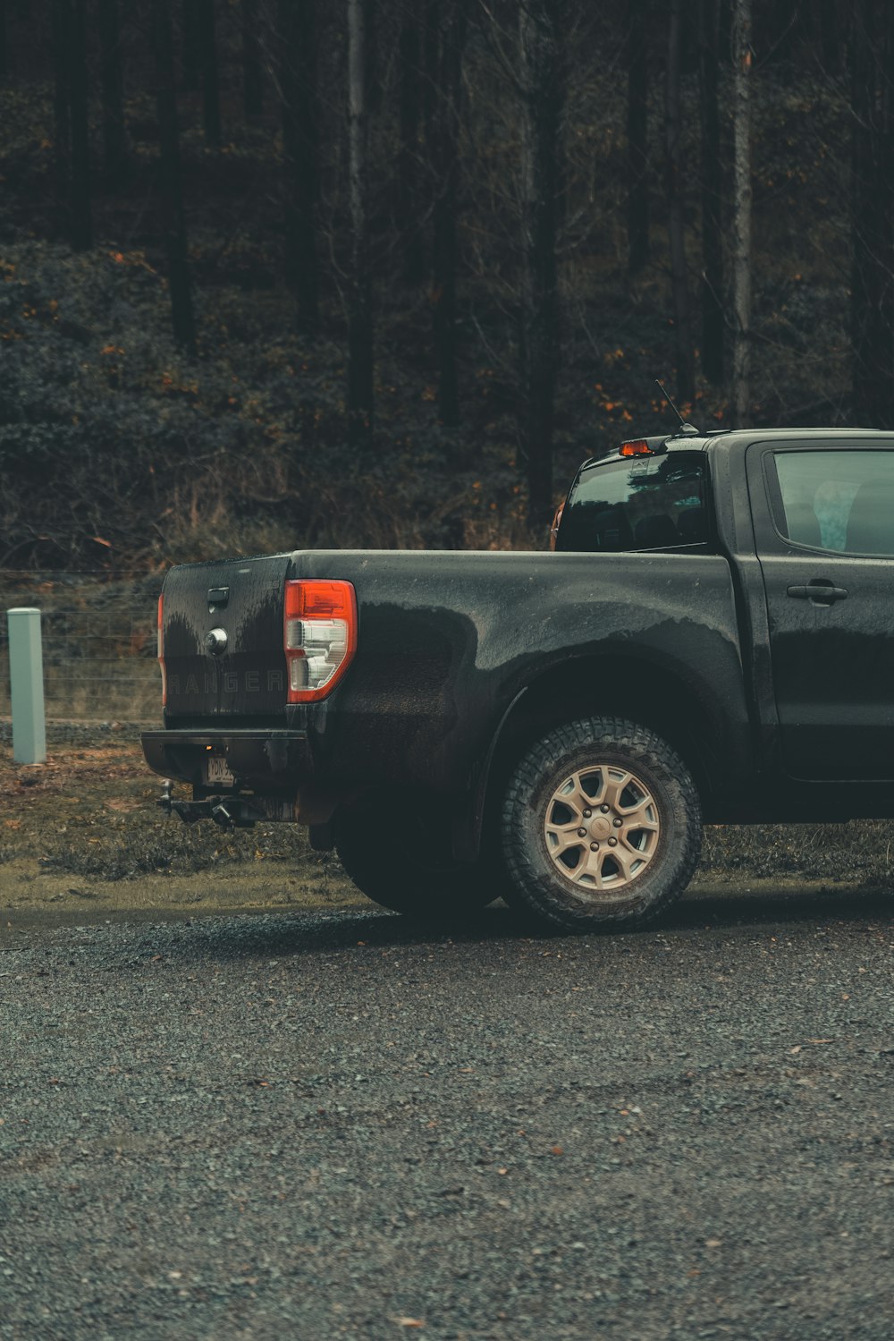 black crew cab pickup truck on road during daytime