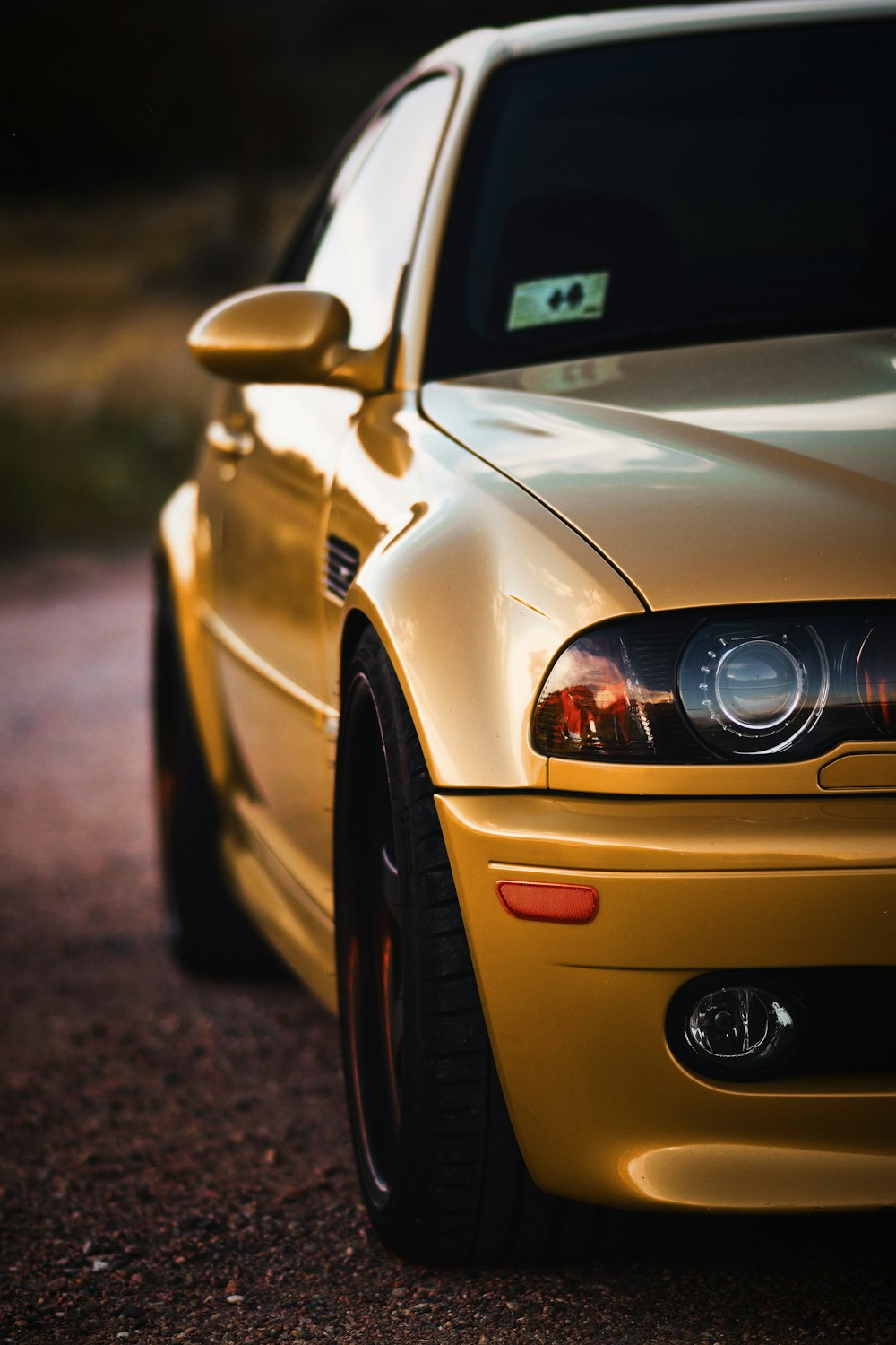 yellow car on brown soil