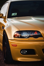 brown car with black and white car in the distance