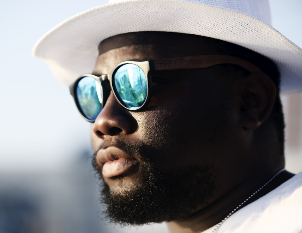 man in black sunglasses and white hat photo – Free Goggles Image on Unsplash