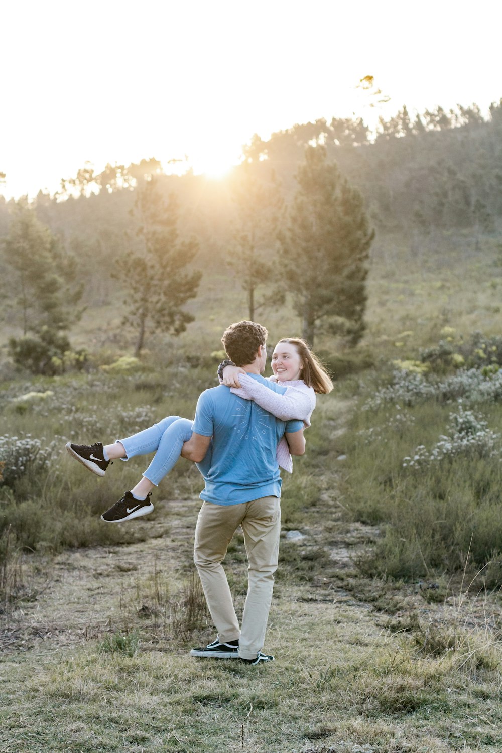 a man carrying a little girl on his back