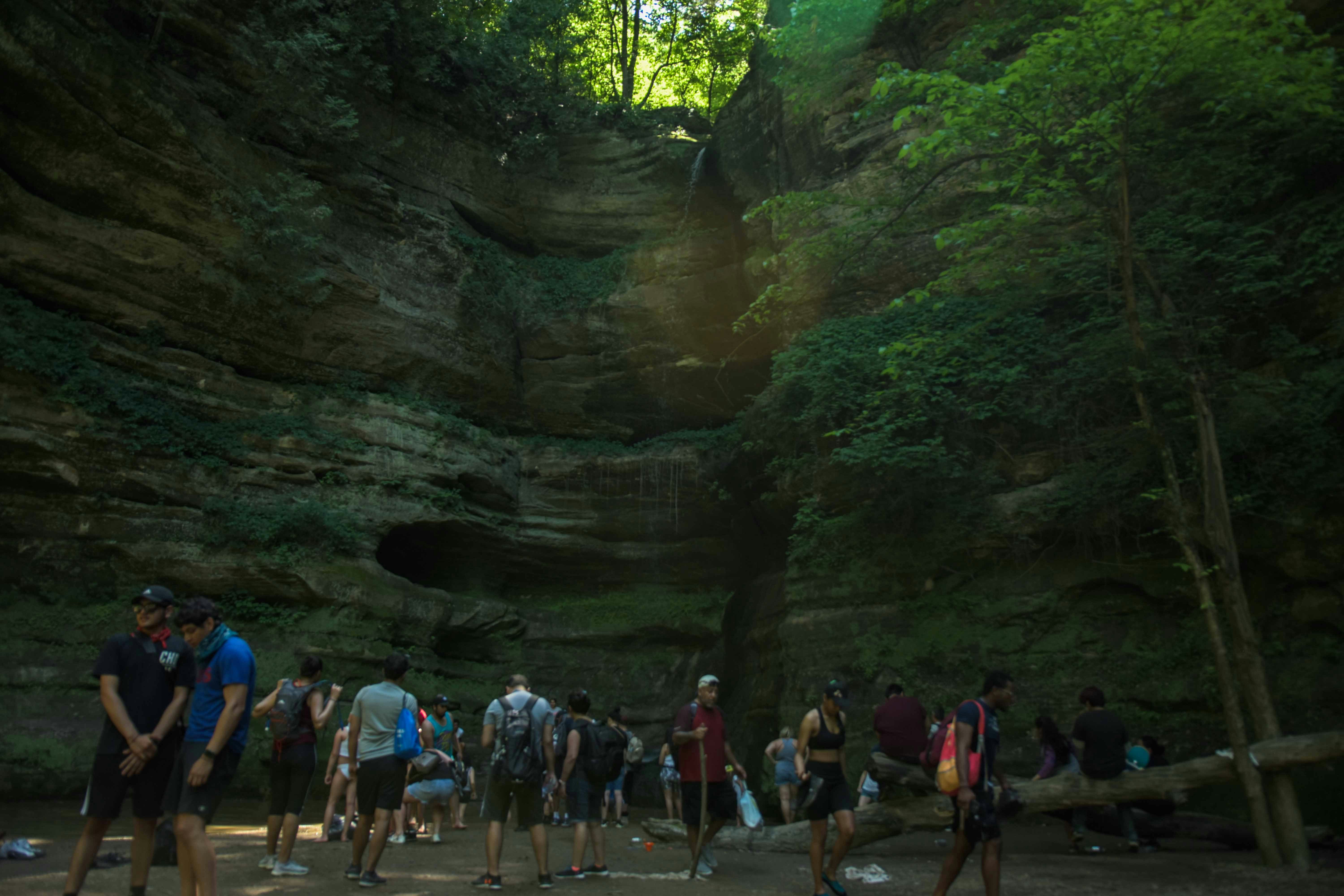 People walking on pathway between rocks during daytime photo – Free ...
