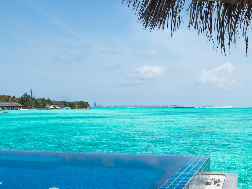 blue body of water under blue sky during daytime