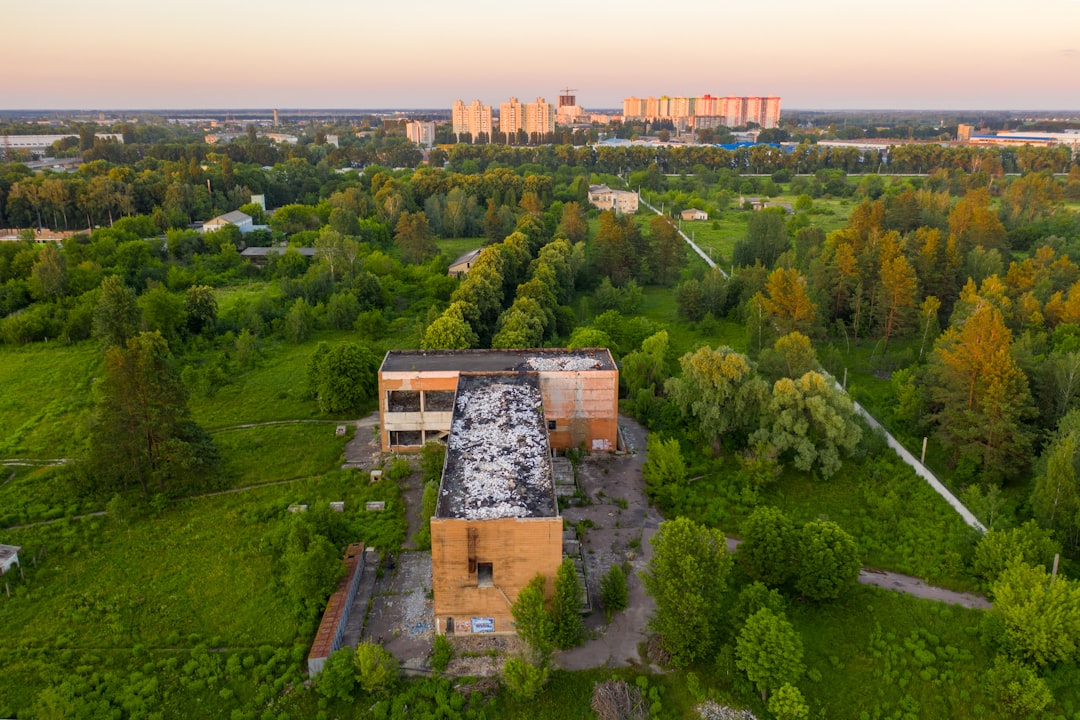 aerial view of green trees and brown concrete building during daytime