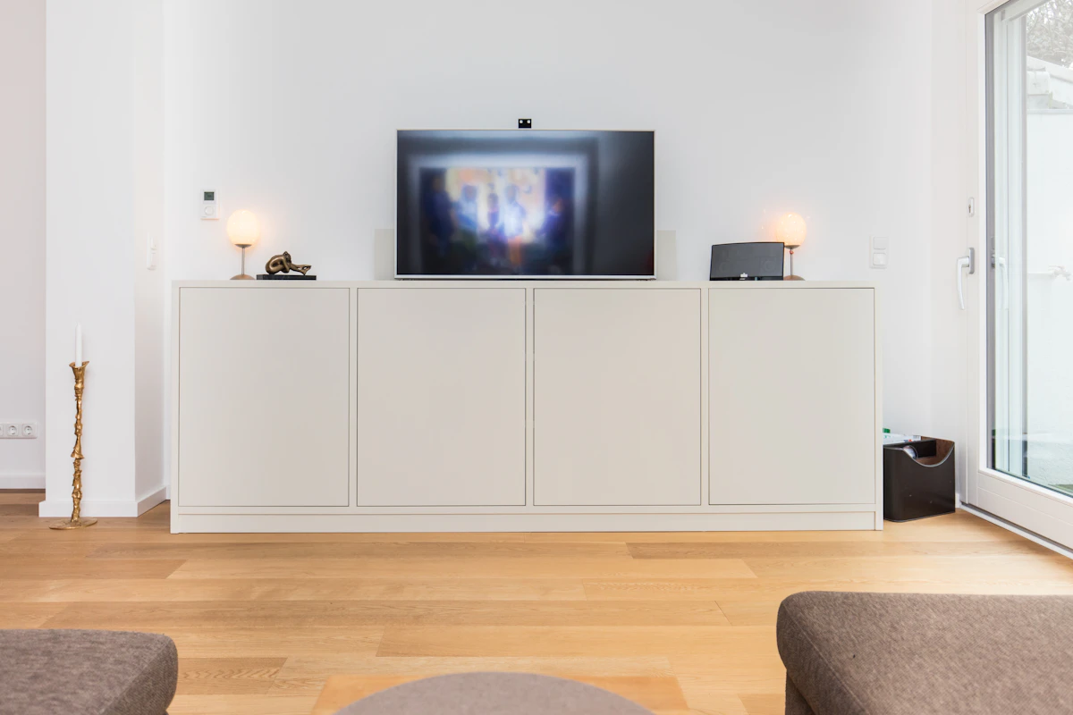 Wall-to-wall media built-in scribed to a plaster wall that moves 14mm across the room