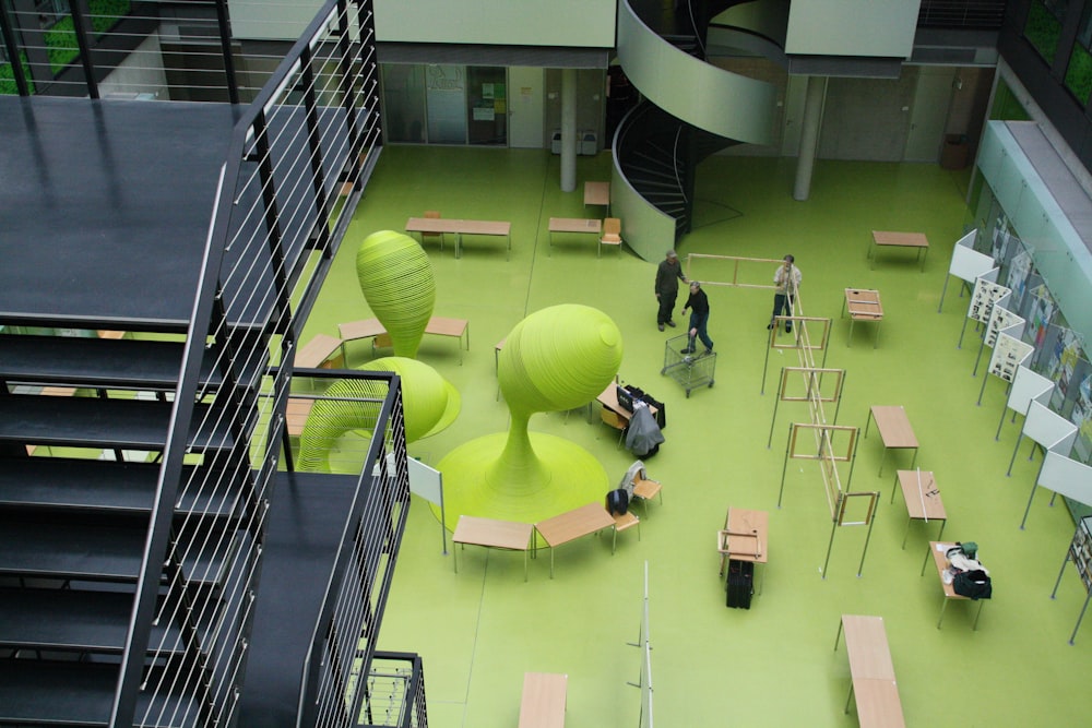 people walking on green floor tiles