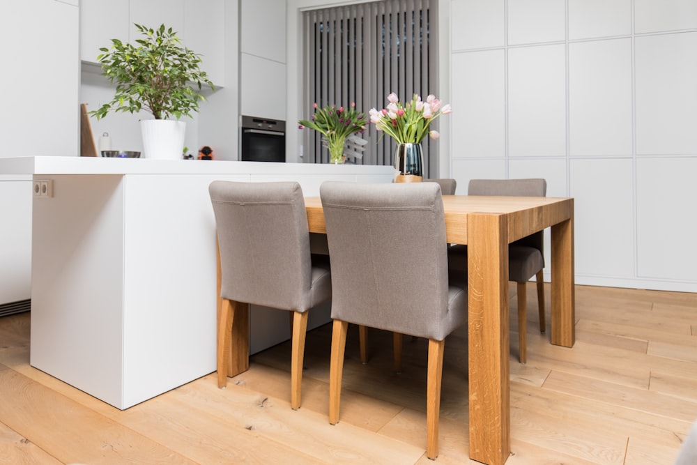 brown wooden table with chairs