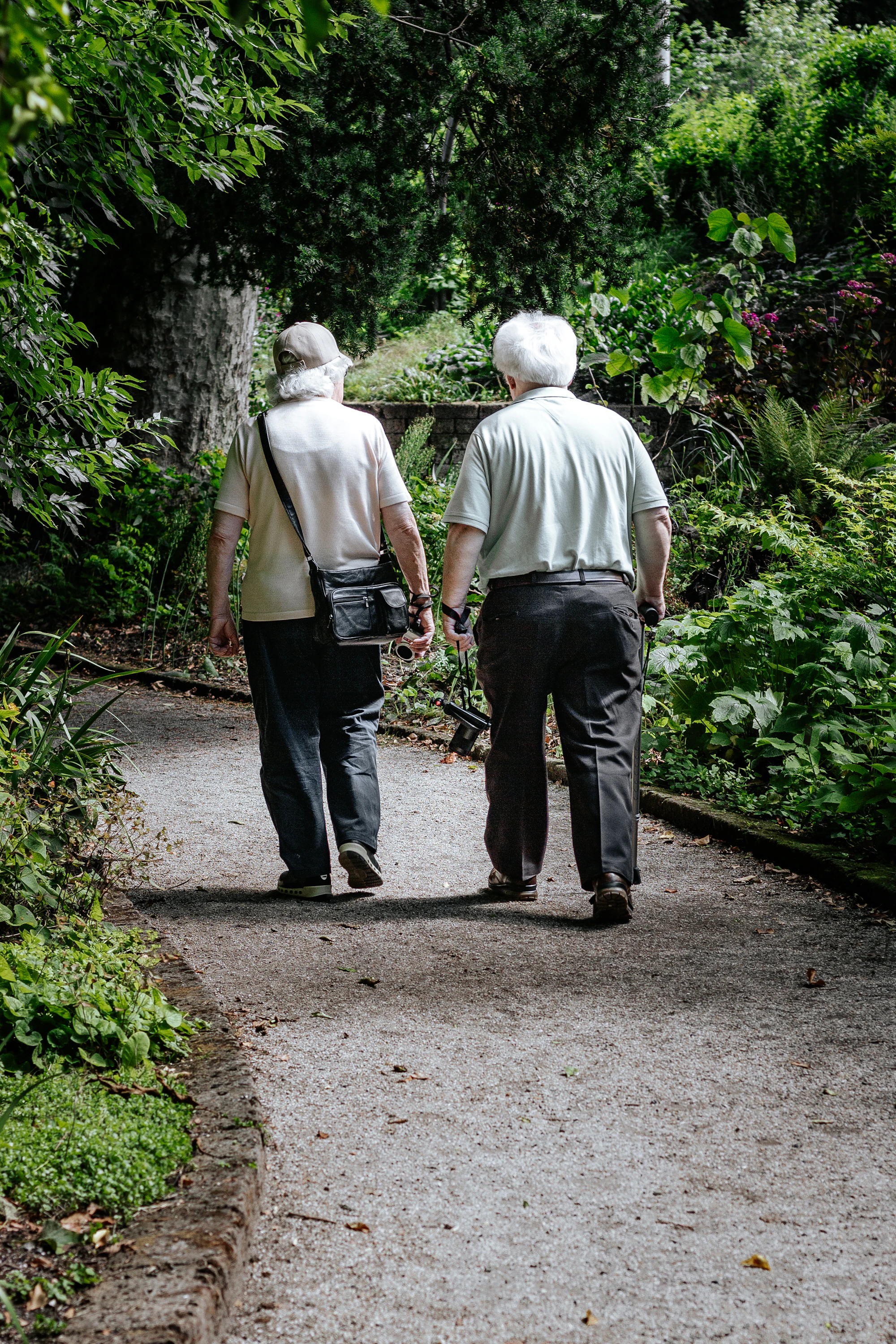 A couple walking a wooded path together