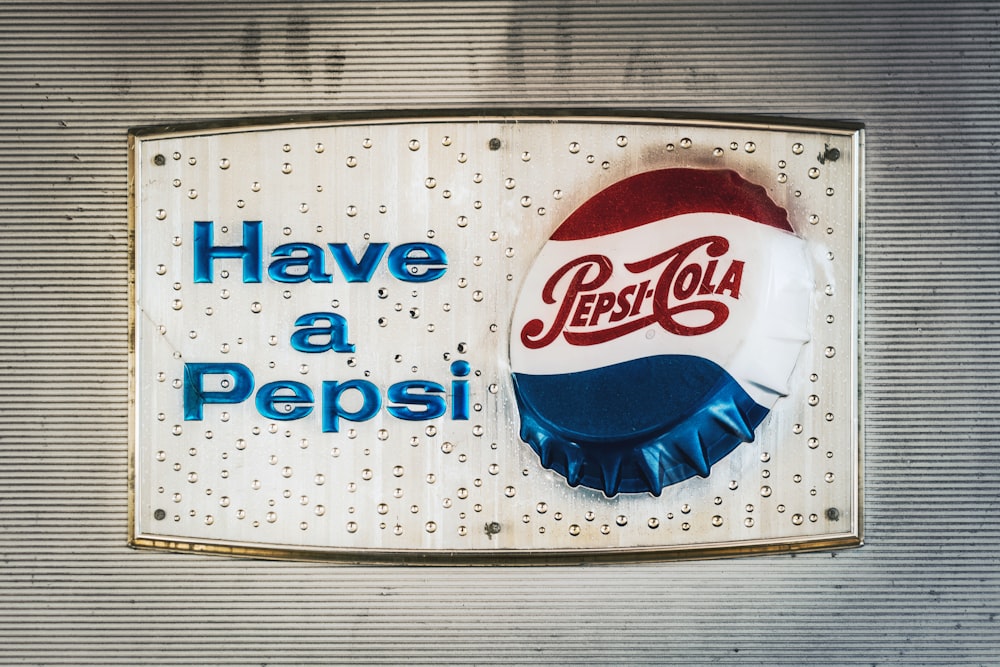 pepsi cola can be seen through blue plastic bag