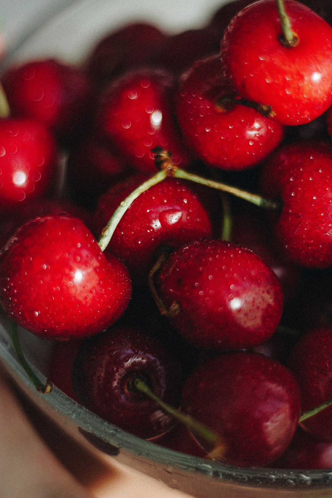 red cherry fruit in blue bowl