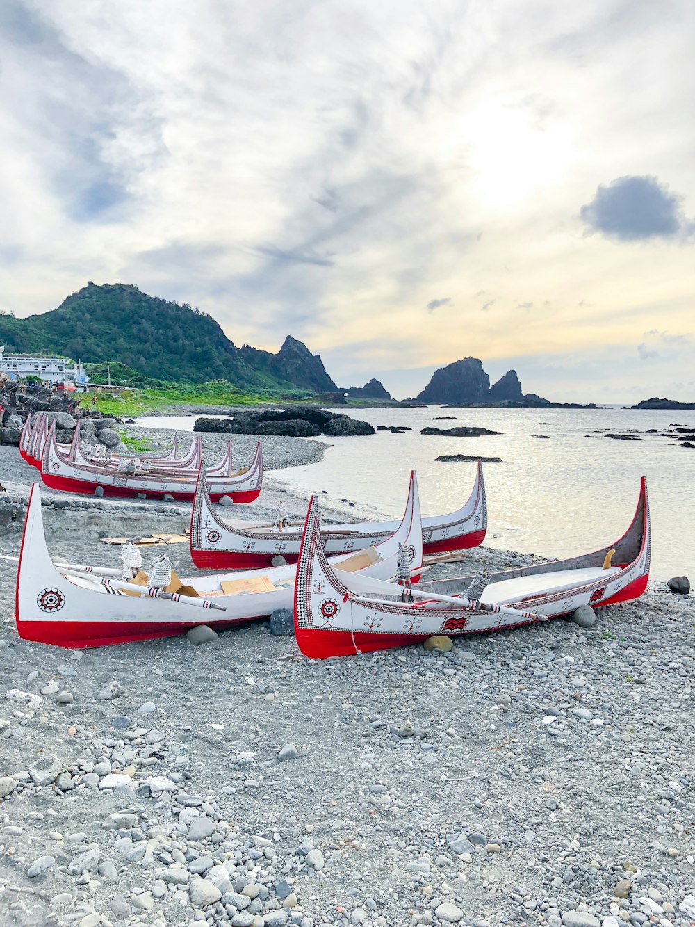 white and red boat on beach during daytime