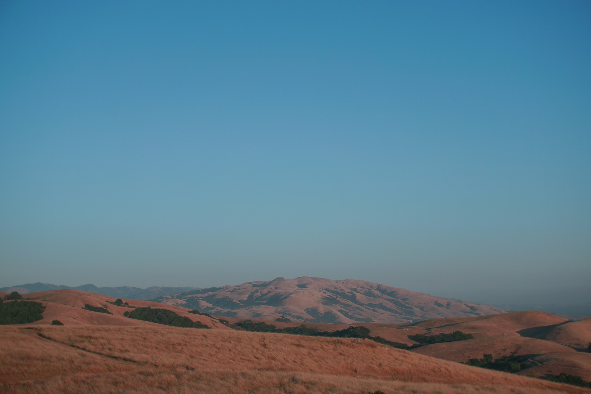 brown mountain under blue sky during daytime