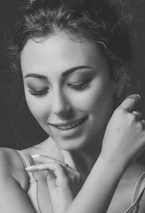 Portrait of a confident woman smiling gently, symbolizing empowerment and support.