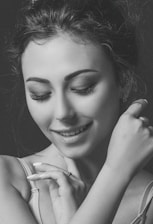 A warm portrait of a confident woman smiling gently, symbolizing empowerment after divorce.