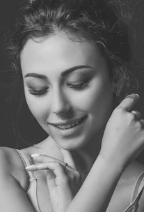 A close-up of a peaceful woman meditating, symbolizing inner harmony and self-growth.