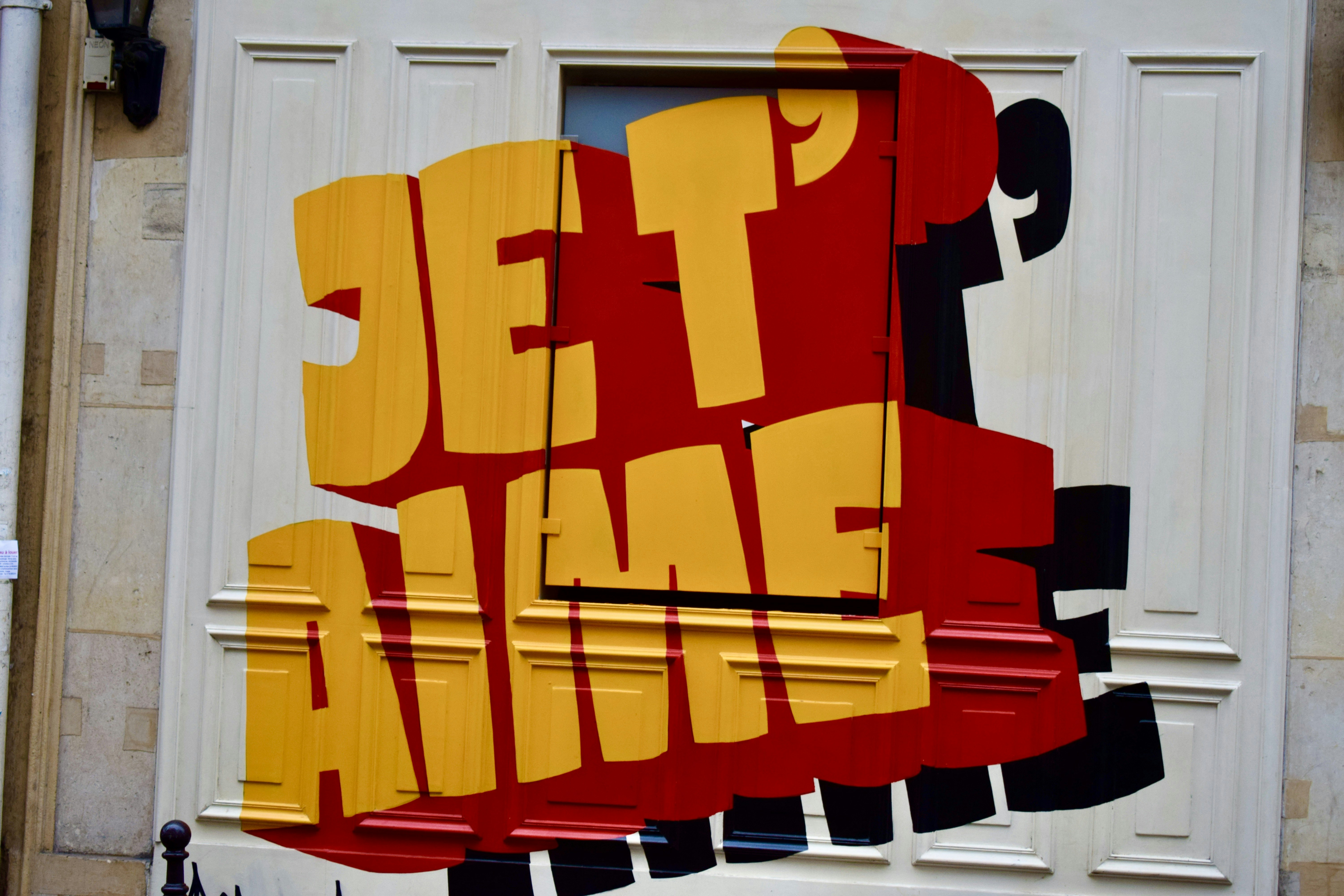 yellow red and blue letter m wall art