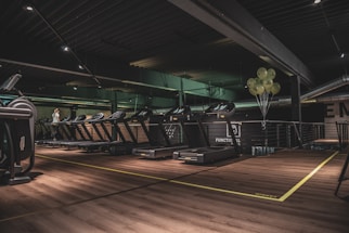 Spotless gym interior with sanitized equipment after professional cleaning service.
