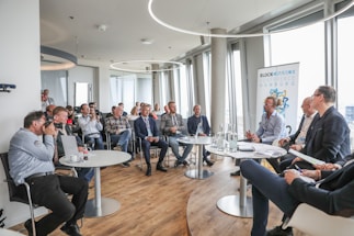 people sitting on chair in conference room