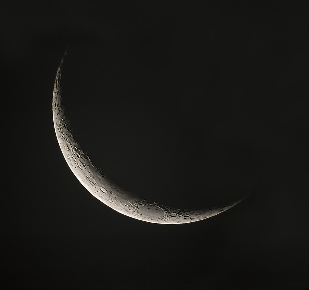 white crescent moon in black background