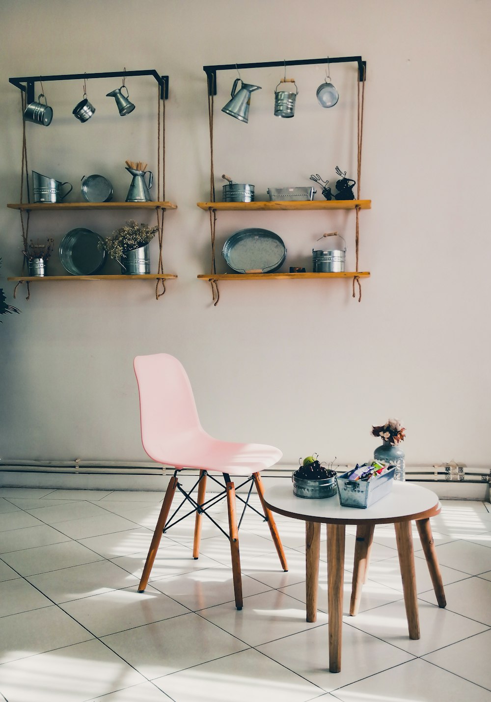 red chair beside table with plates and bowls