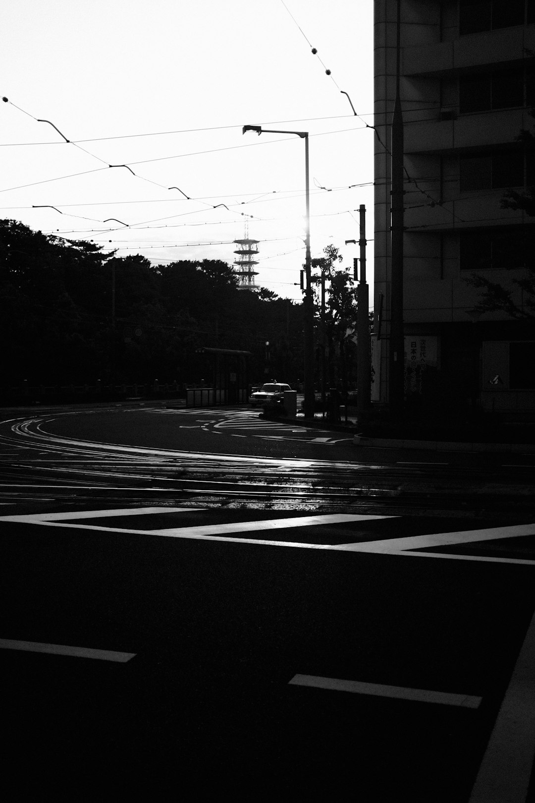 grayscale photo of a road with cars