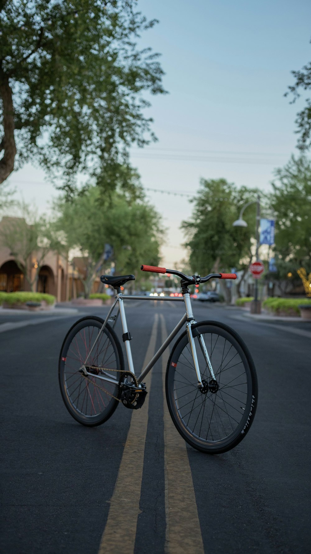 black and white road bike on road during daytime