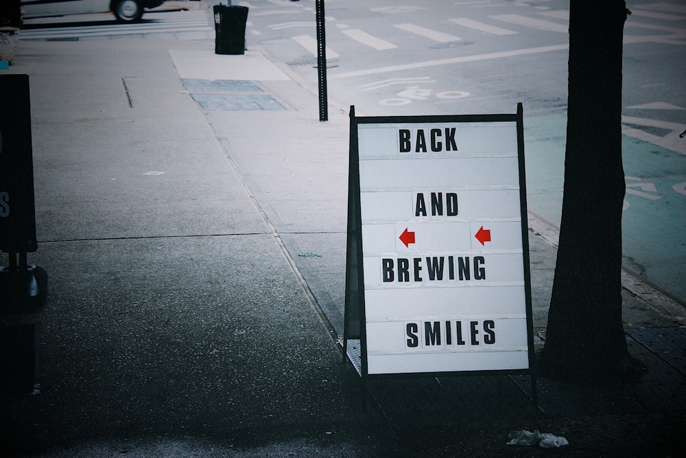 grayscale photo of street sign