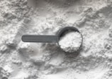 black magnifying glass on white and brown marble table