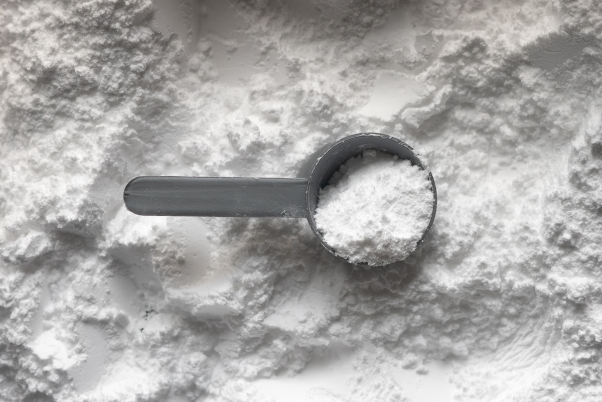 Whey Isolate 90 — protein tub on stone backdrop