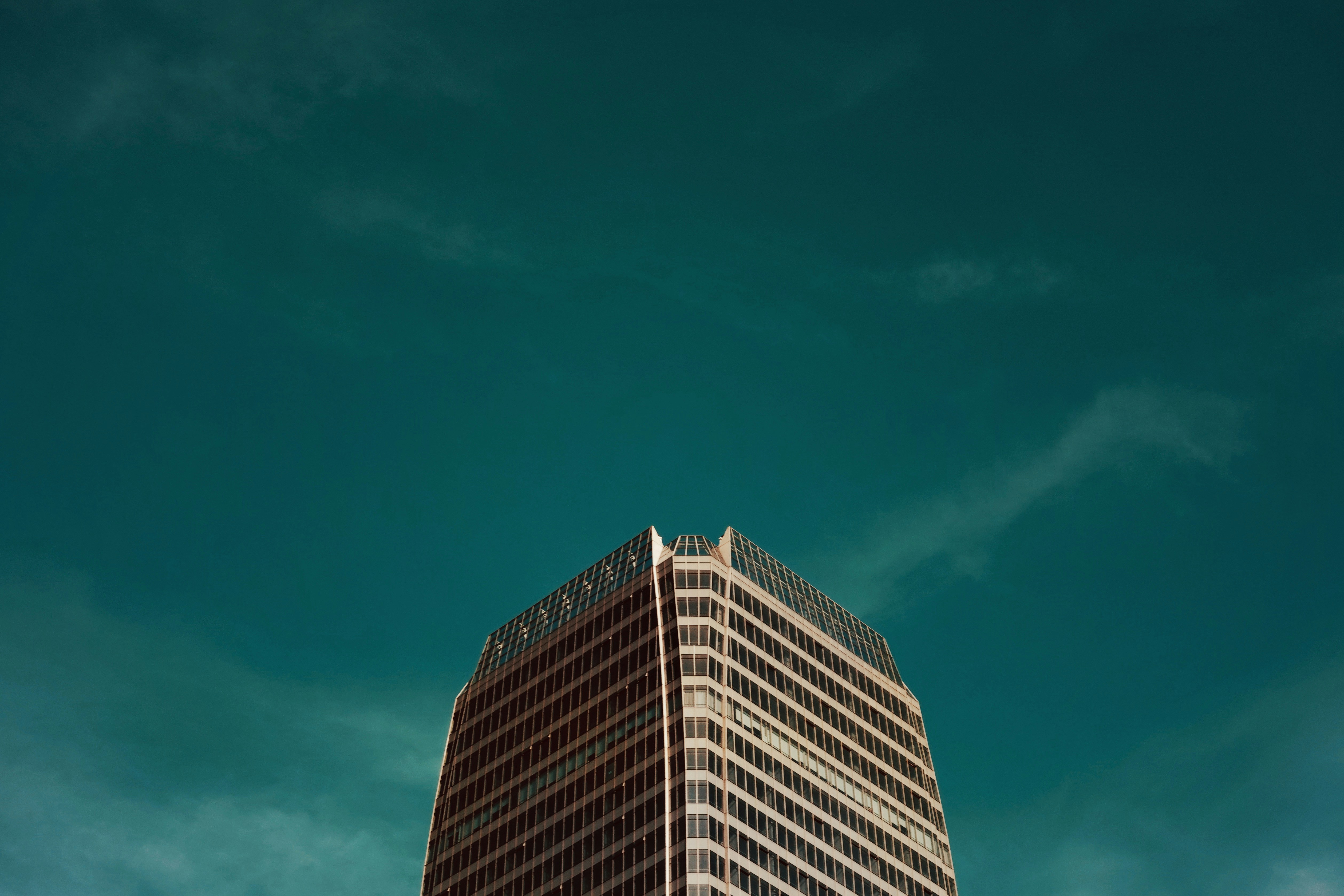 white and black concrete building under blue sky during daytime